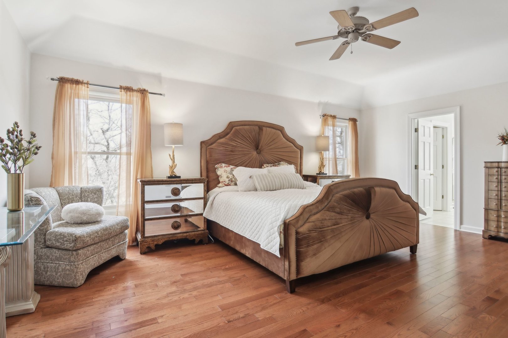 1005 Bridle Lane Cary, IL 60013 - Photo 25 of 64 a spacious bedroom with a bed and a couch
