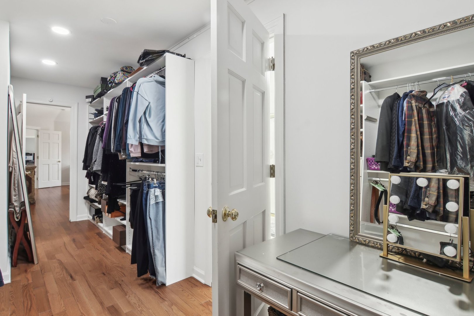 1005 Bridle Lane Cary, IL 60013 - Photo 31 of 64 a view of walk in closet with clothes and shoes