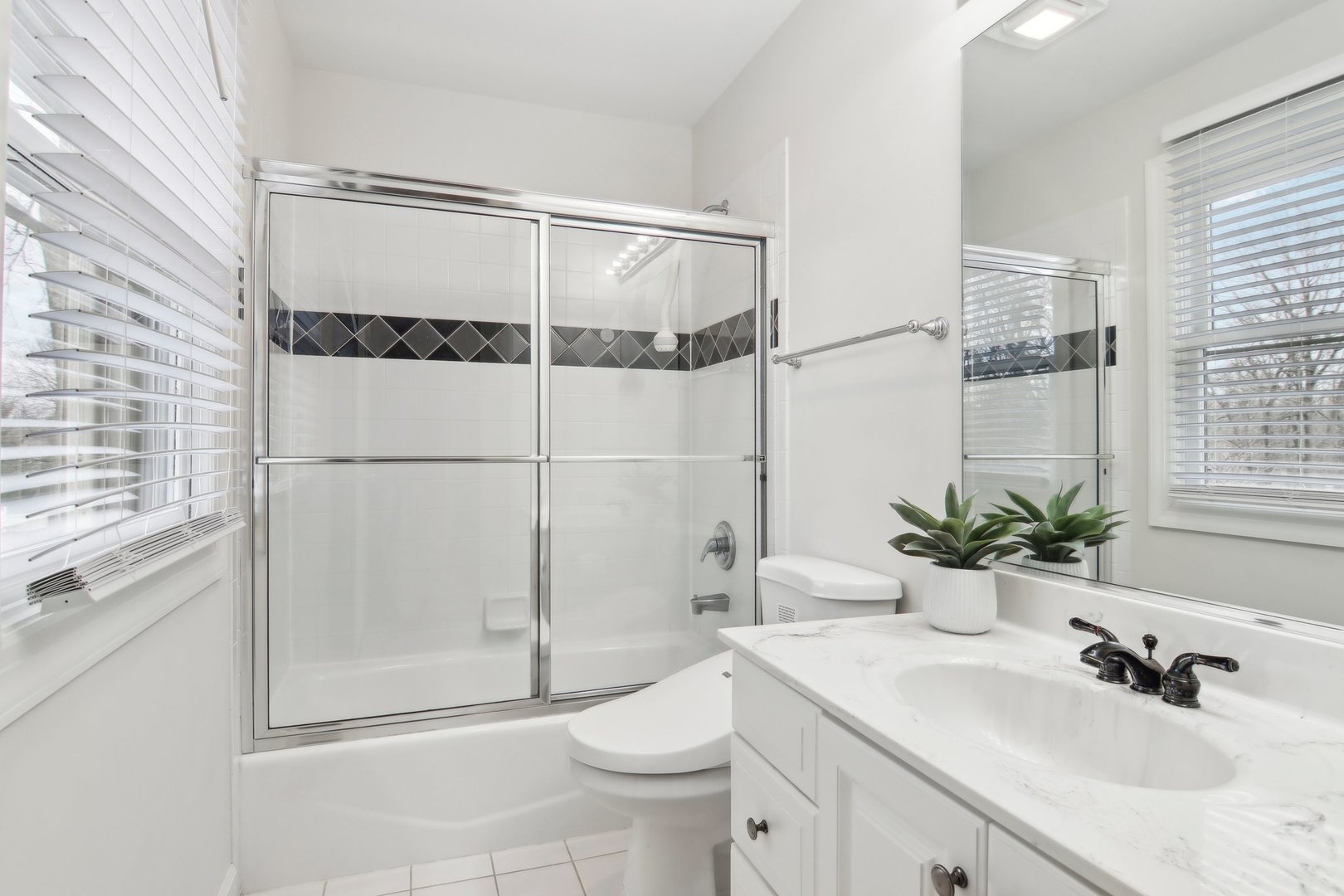 1005 Bridle Lane Cary, IL 60013 - Photo 34 of 64 a bathroom with a sink toilet and shower