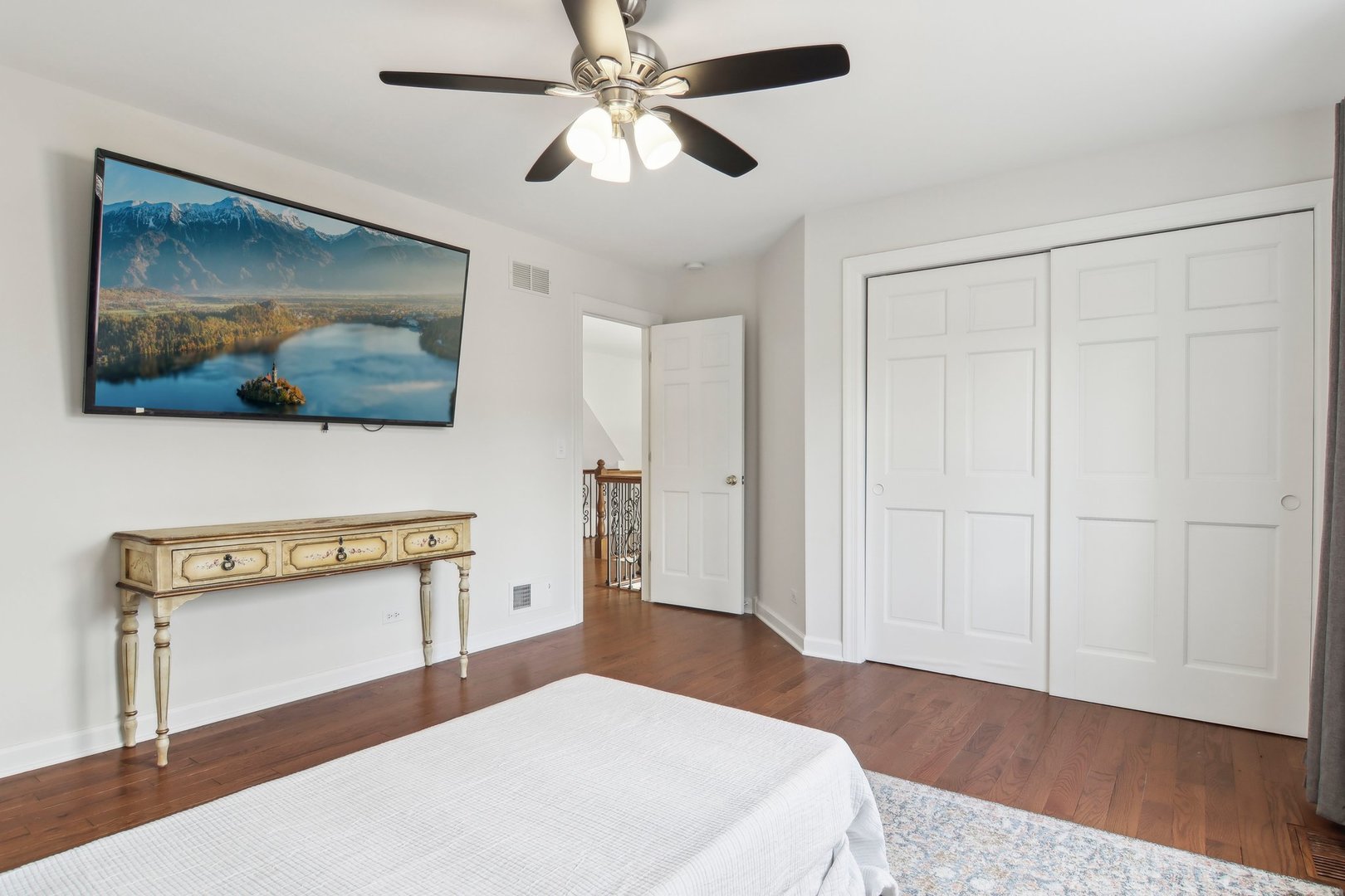 1005 Bridle Lane Cary, IL 60013 - Photo 36 of 64 a bedroom with a bed and a painting on the wall