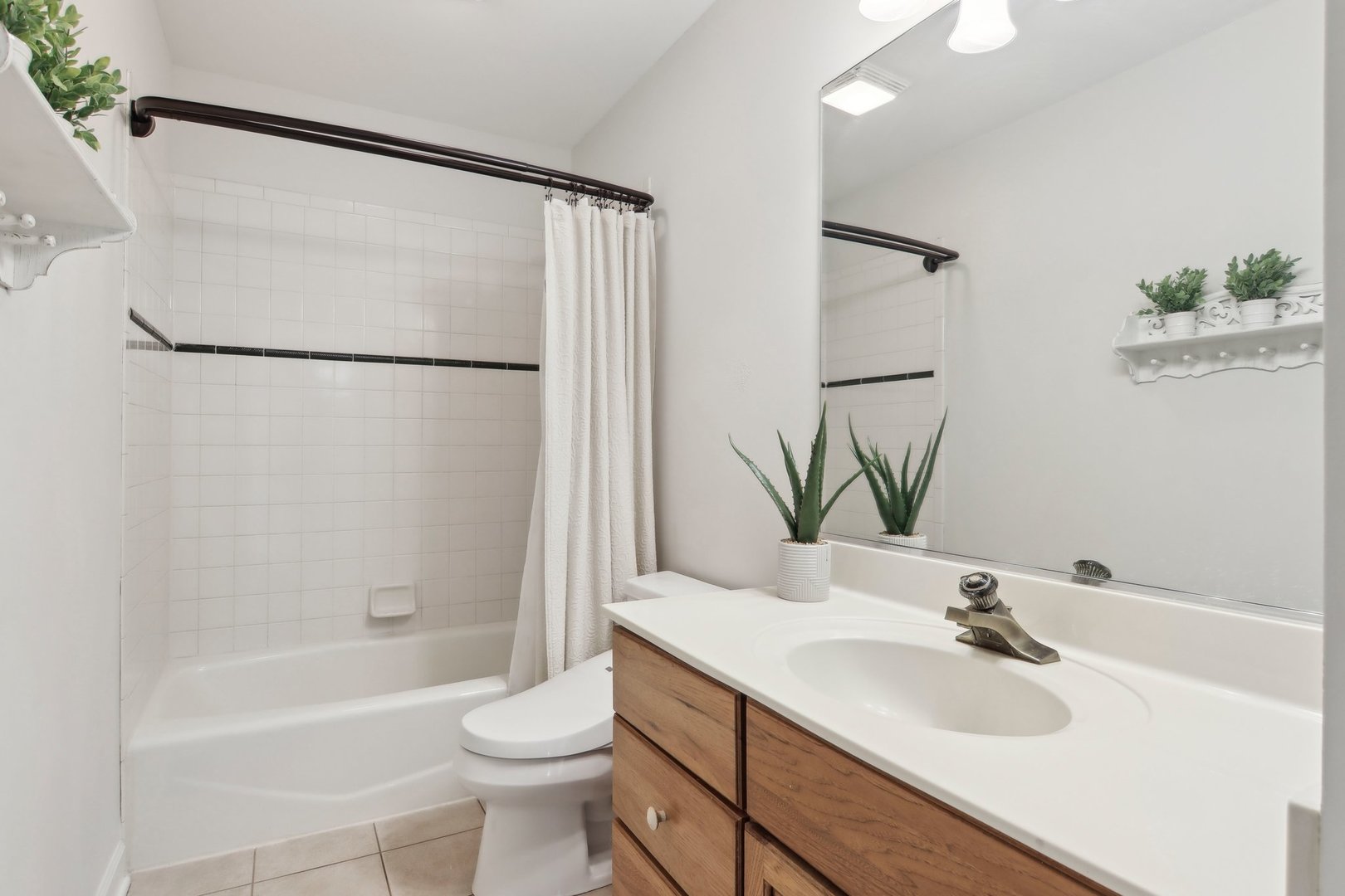 1005 Bridle Lane Cary, IL 60013 - Photo 37 of 64 a bathroom with a sink a toilet and shower