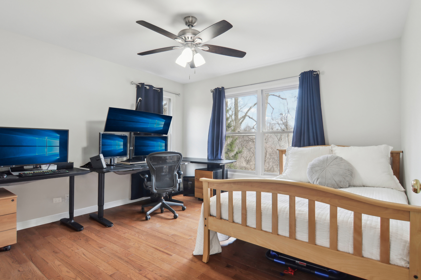 1005 Bridle Lane Cary, IL 60013 - Photo 38 of 64 a bedroom with furniture a window and a ceiling fan
