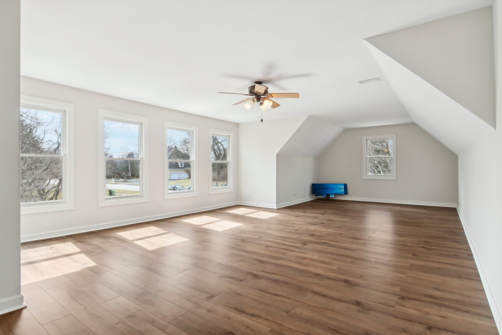 1005 Bridle Lane Cary, IL 60013 - Photo 40 of 64 a view of an empty room with window and wooden floor