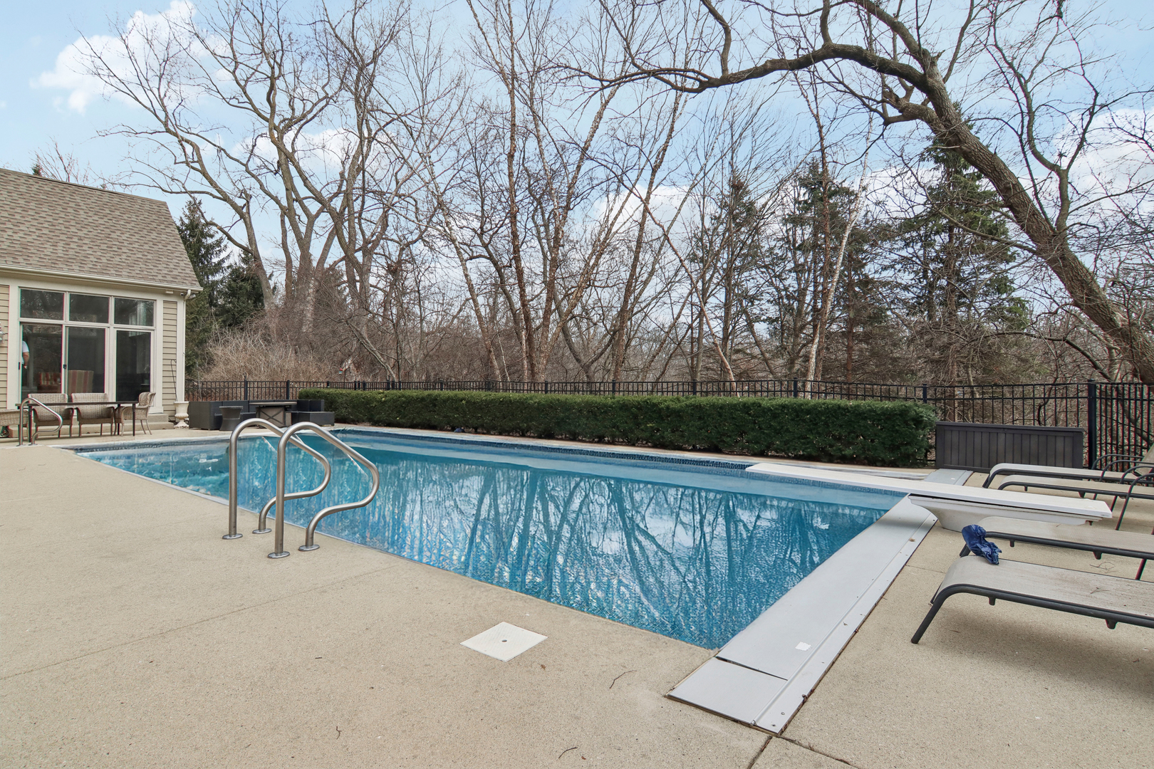 1005 Bridle Lane Cary, IL 60013 - Photo 51 of 64 a view of a swimming pool with a lounge chair