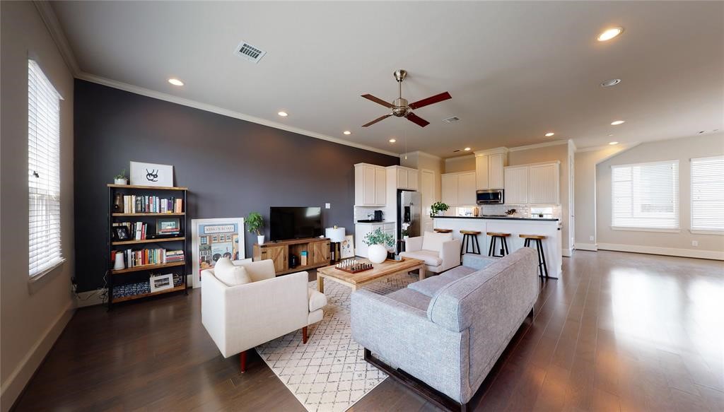 2724 Rutland Street Houston, TX 77008 - Photo 11 of 29 a living room with furniture and a wooden floor
