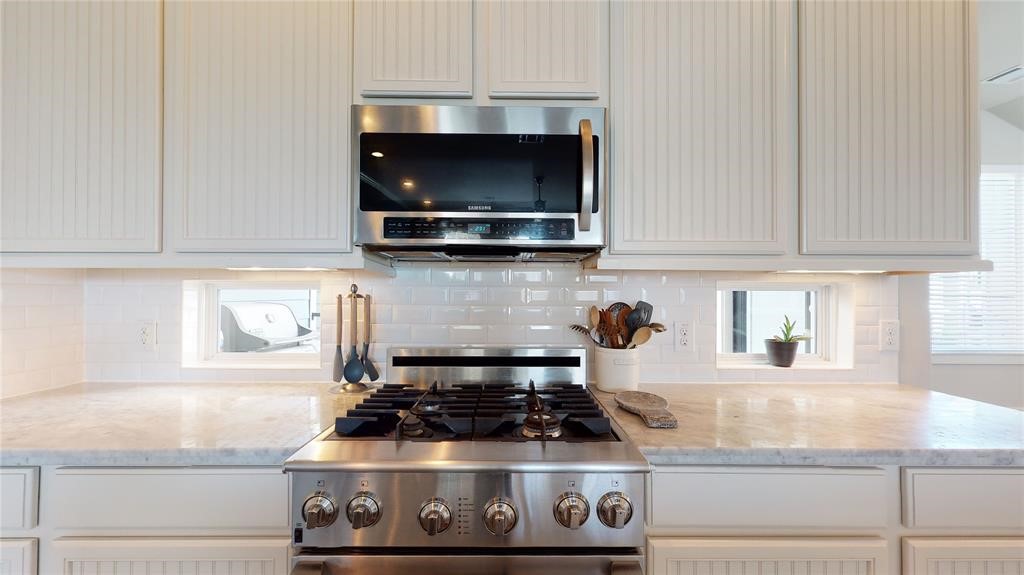 2724 Rutland Street Houston, TX 77008 - Photo 13 of 29 a kitchen with a stove and a microwave