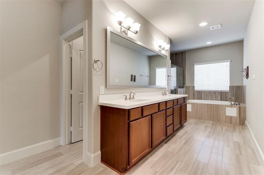 2724 Rutland Street Houston, TX 77008 - Photo 20 of 29 a bathroom with a double vanity sink mirror and bathtub