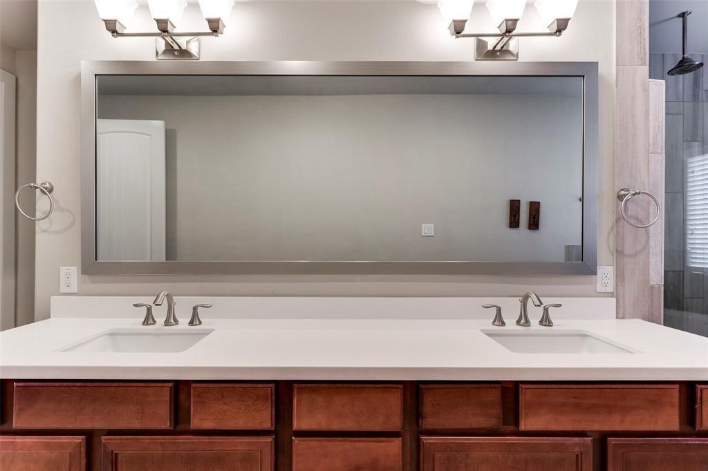 2724 Rutland Street Houston, TX 77008 - Photo 21 of 29 a bathroom with a sink and a mirror
