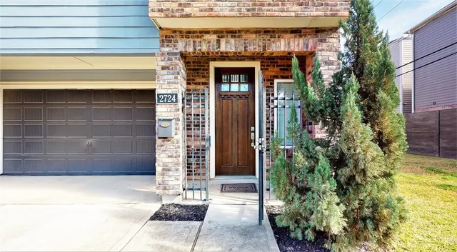 a front view of a house with a garage