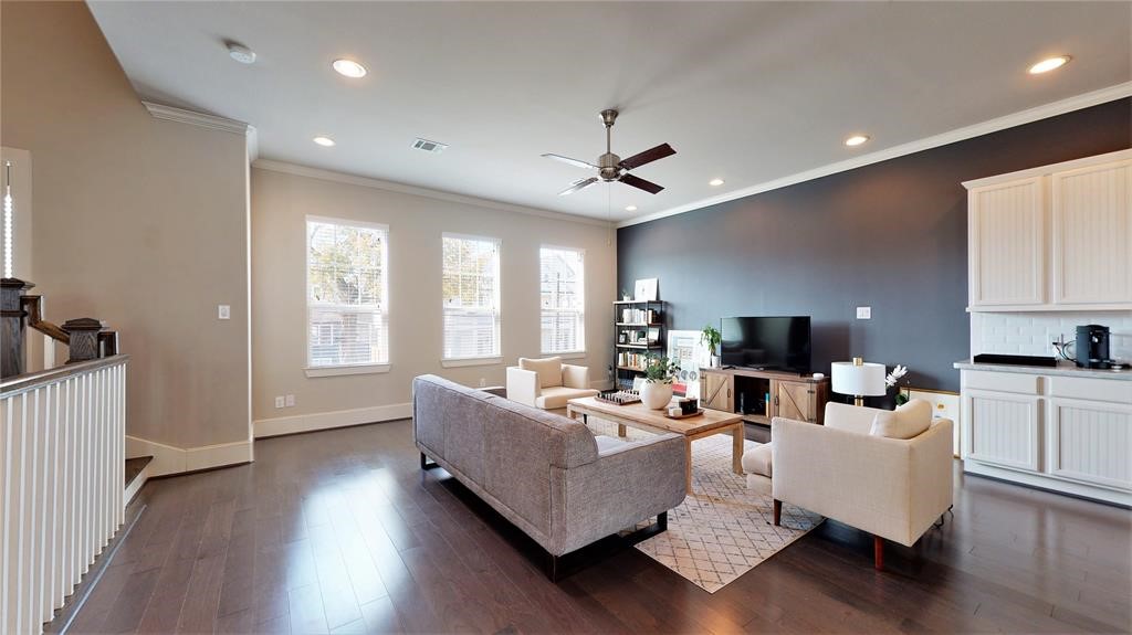 2724 Rutland Street Houston, TX 77008 - Photo 9 of 29 a living room with furniture and a wooden floor