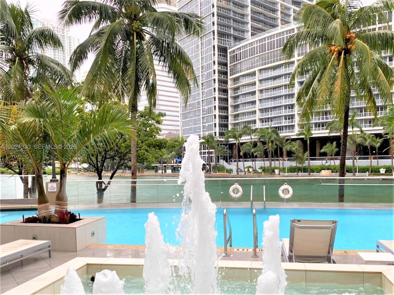 901 Brickell Key Boulevard, Unit 2006 Miami, FL 33131 - Photo 34 of 41 Pool Area - Heated Pool - Overlooking the Miami River