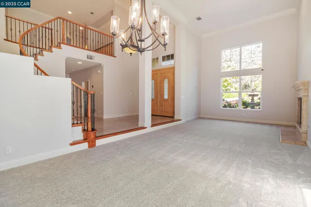 a view of an empty room and closet area