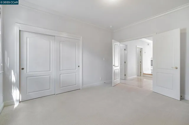 a view of an empty room and entryway