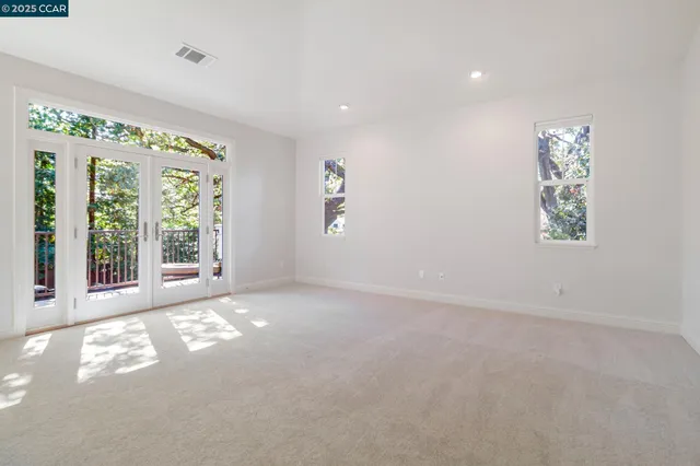 a spacious bathroom with a granite countertop sink a mirror a vanity and a