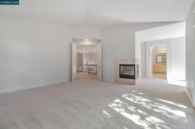 a bathroom with a double vanity sink a mirror and a bathtub