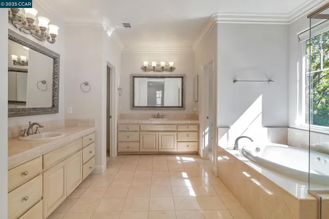 a view of a patio with table and chairs under an umbrella