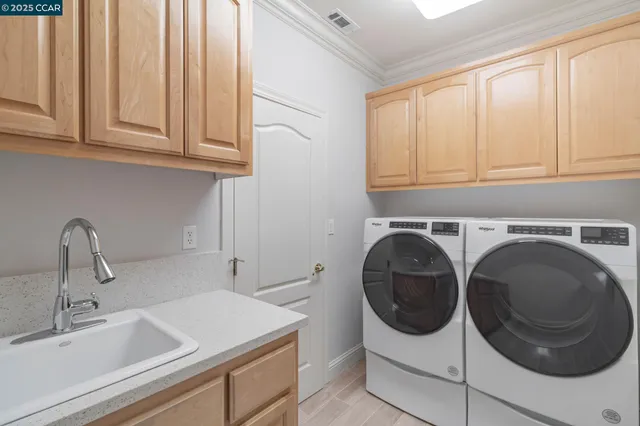 a view of a table and chairs under an umbrella