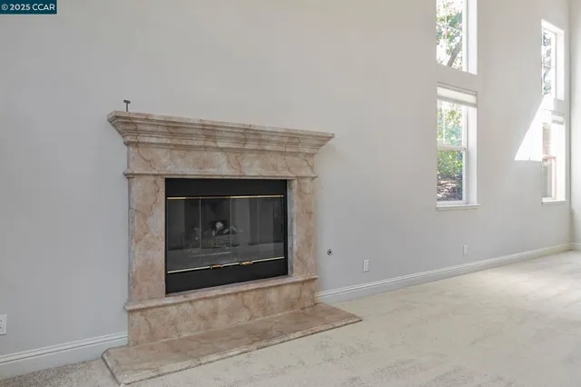a view of empty room with floor to ceiling window