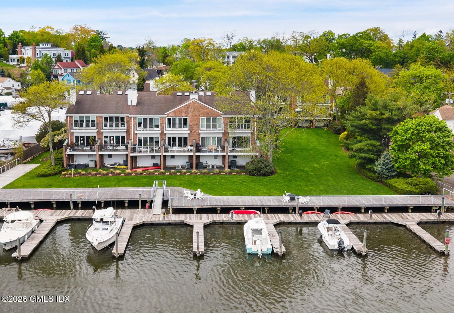 115 River Road, Unit 3 Cos Cob, CT 06807 - Photo 2 of 40 a view of a city with lawn chairs