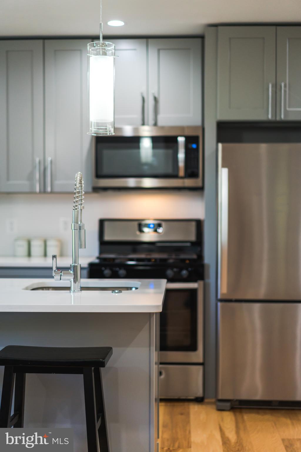 400 Newcomb Street Southeast, Unit 6 Washington, DC 20032 - Photo 11 of 29 a kitchen with appliances cabinets and a counter top space