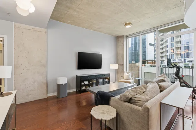 a living room with furniture and a flat screen tv