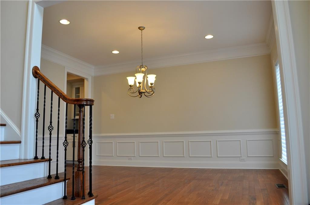 113 Coventry Drive McKees Rocks, PA 15136 - Photo 4 of 23 Formal Dining Room with wainscoting, chair rail, crown molding and two front facing widows for loads of natural light.