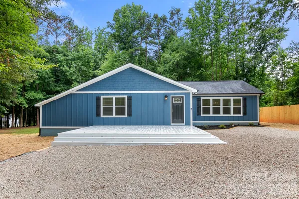 a front view of a house with yard
