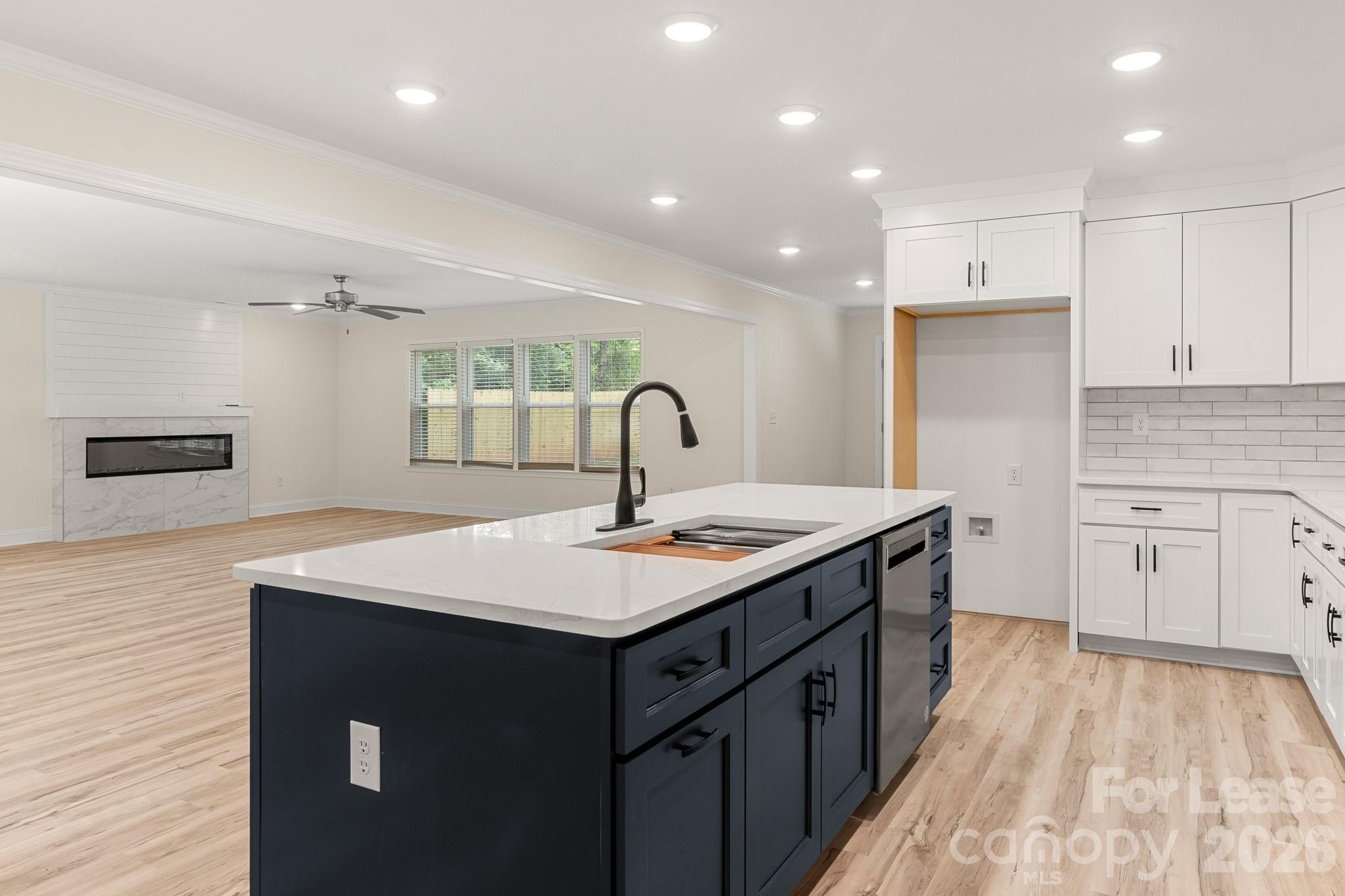 116 Maple Grove Church Road Matthews, NC 28104 - Photo 11 of 41 a kitchen with a sink stove and cabinets