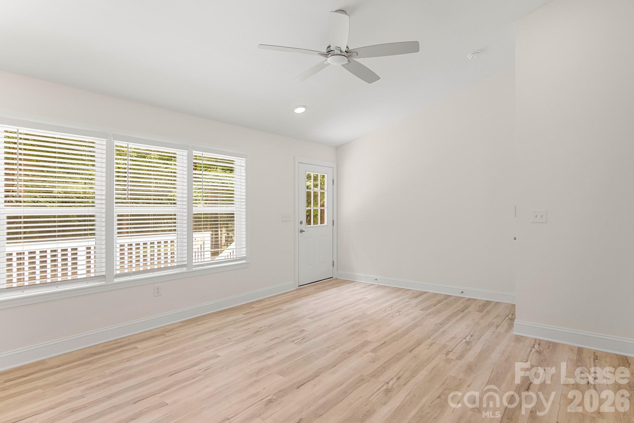 116 Maple Grove Church Road Matthews, NC 28104 - Photo 22 of 41 wooden floor in an empty room with a window