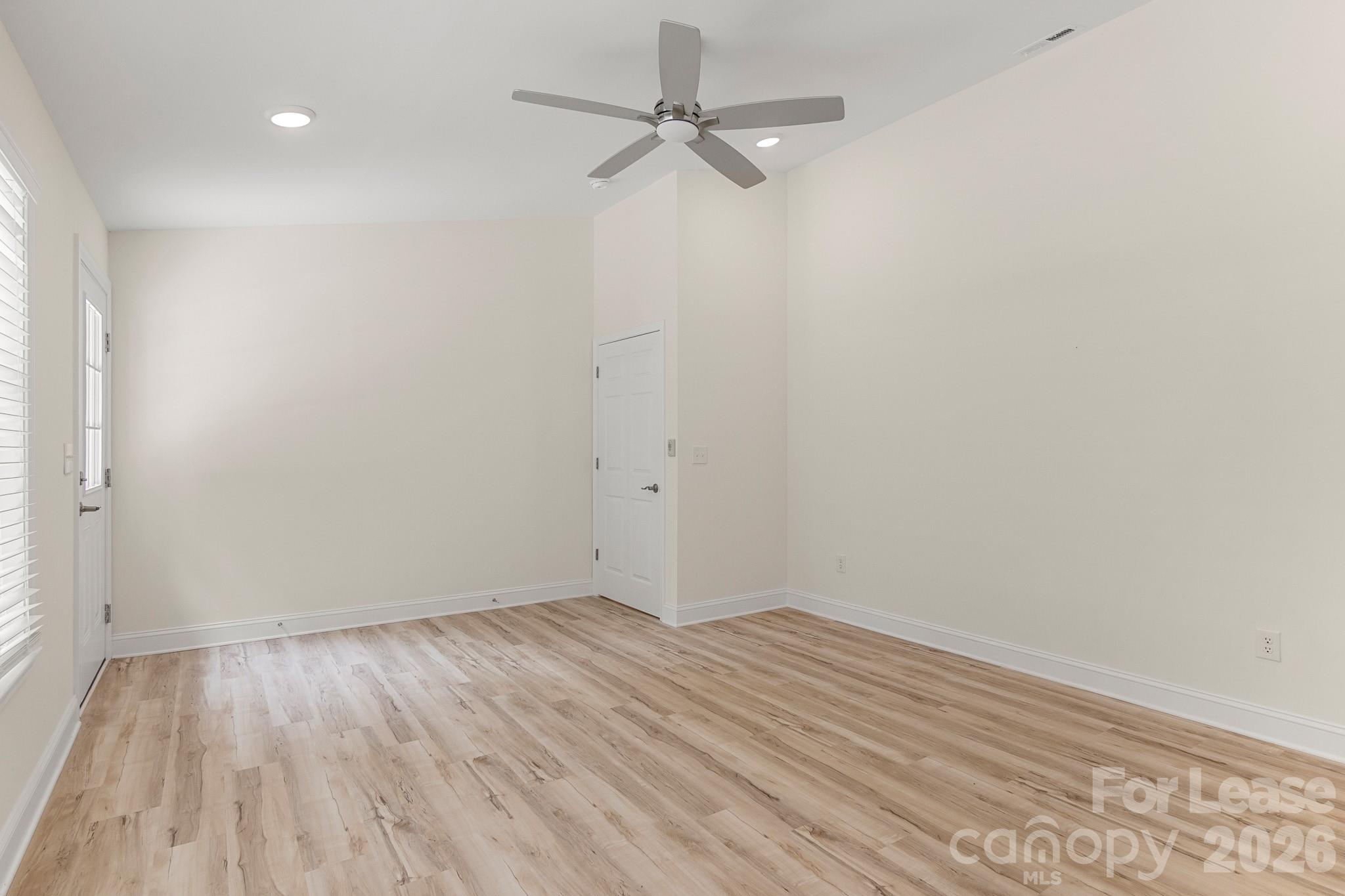 116 Maple Grove Church Road Matthews, NC 28104 - Photo 23 of 41 wooden floor in an empty room with a window