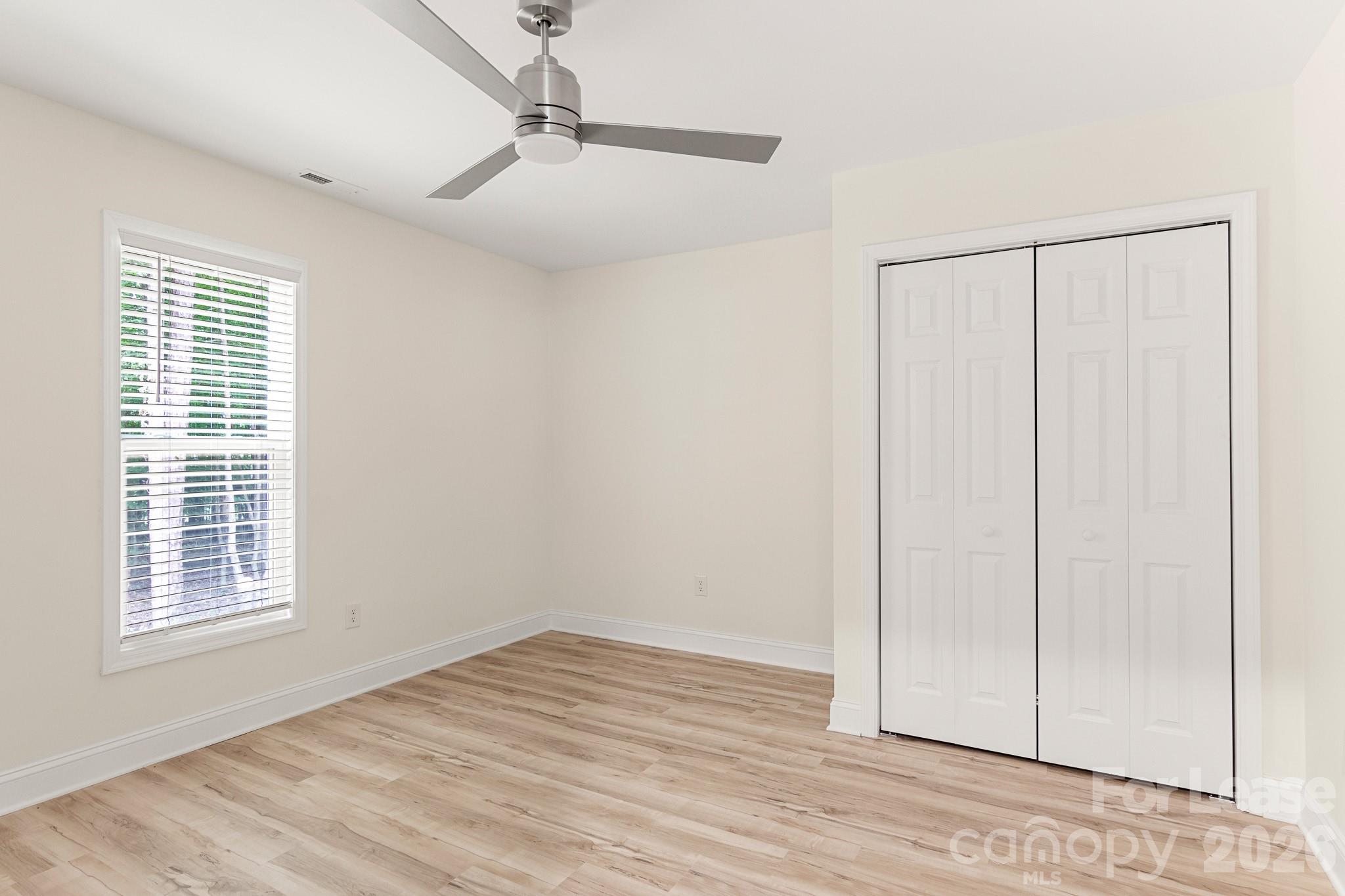 116 Maple Grove Church Road Matthews, NC 28104 - Photo 28 of 41 a view of a livingroom with wooden floor and a window