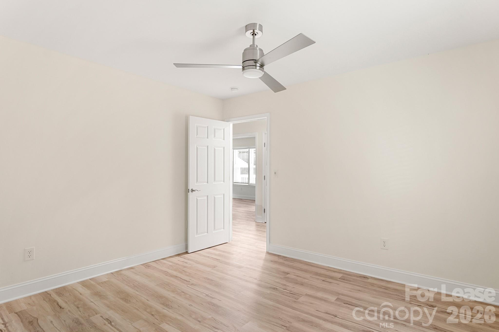 116 Maple Grove Church Road Matthews, NC 28104 - Photo 29 of 41 a view of empty room with wooden floor