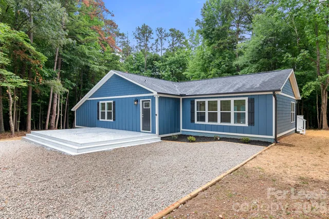 a front view of a house with yard