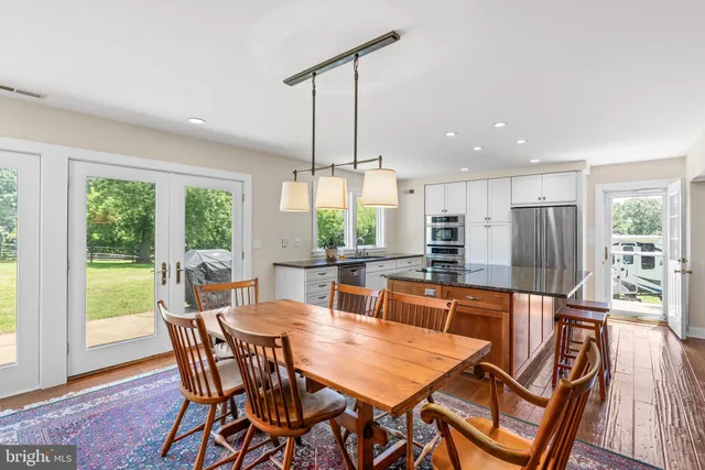 a kitchen with stainless steel appliances granite countertop a stove oven and a refrigerator