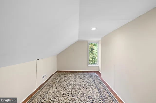 a front view of a house with a yard table and chairs