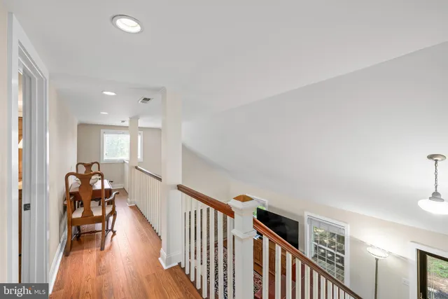 front view of a house with a tree in a yard