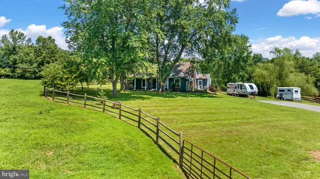 a view of a house with a big yard