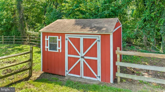 a view of a patio with table and chairs and potted plants
