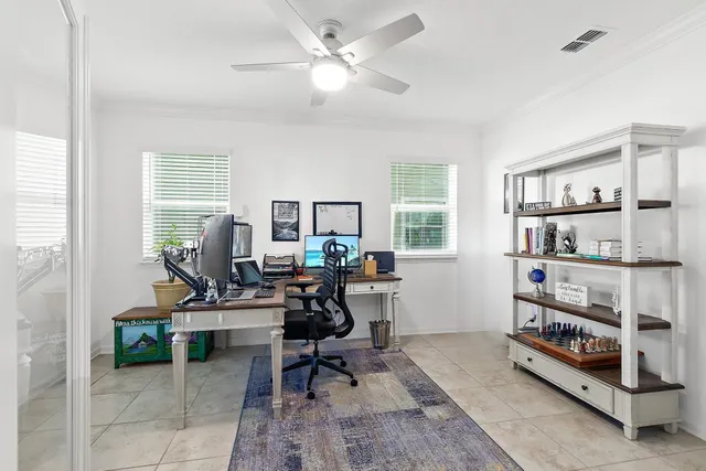 a view of a workspace with a window and lounge chair