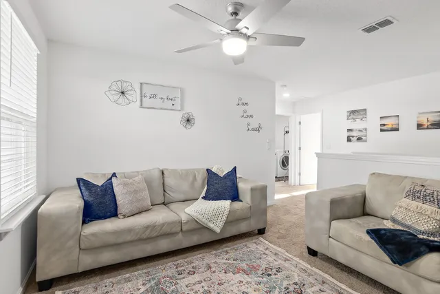 a living room with furniture and a couch