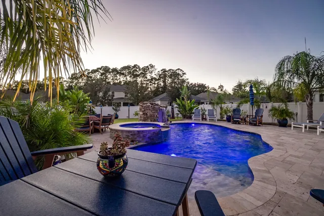 a view of a swimming pool with lounge chair