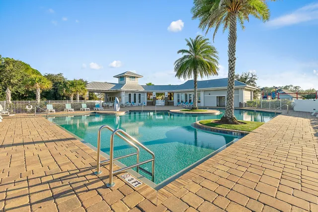 a view of swimming pool with chairs