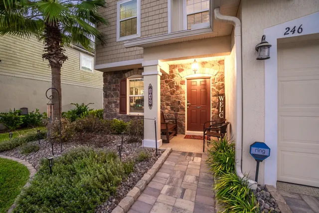 a view of a house with a backyard and porch
