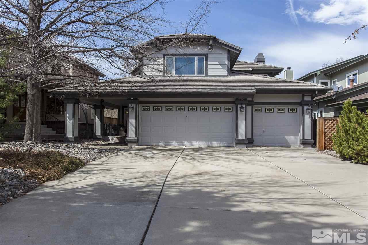 3985 Riverhaven Drive Reno, NV 89519 - Photo 1 of 25 a front view of a house with a garden