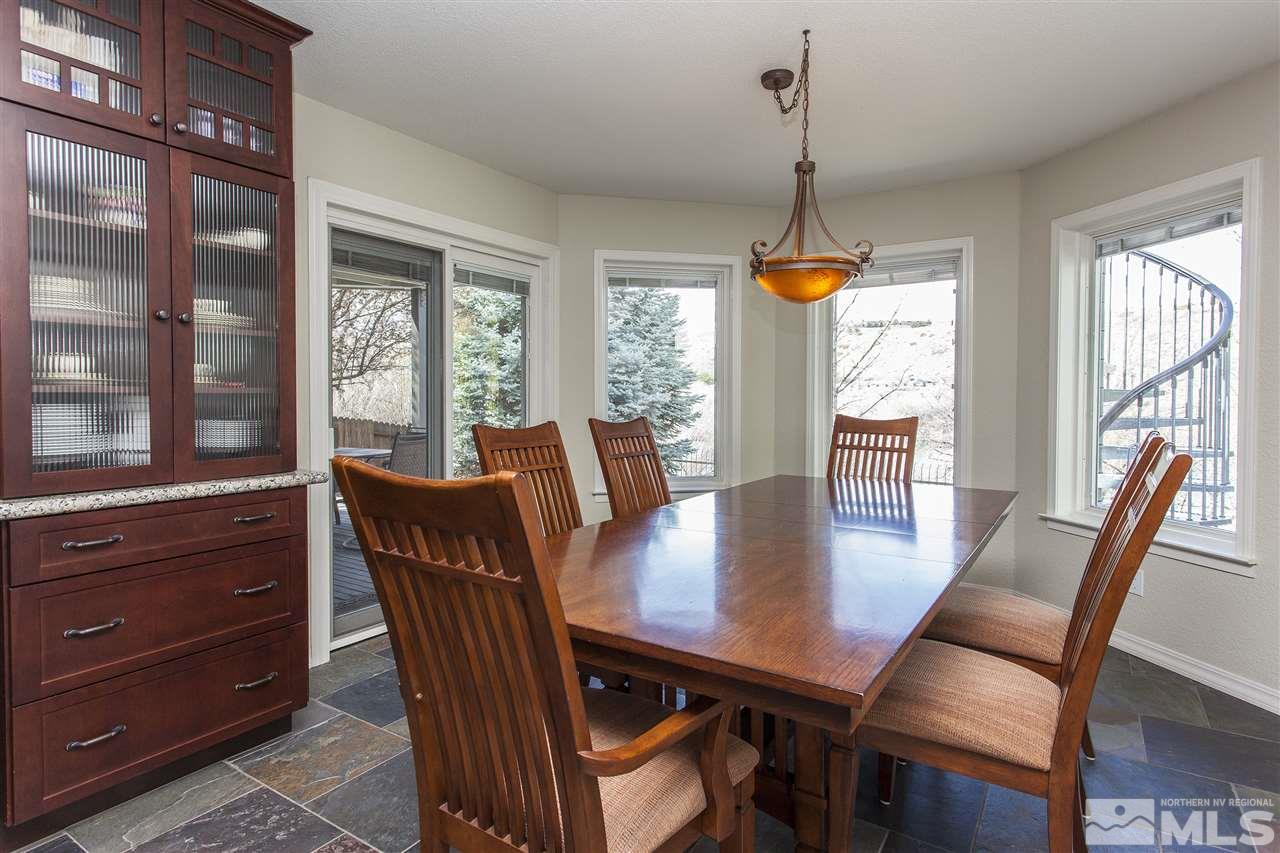 3985 Riverhaven Drive Reno, NV 89519 - Photo 11 of 25 a view of a dining room with furniture window and wooden floor