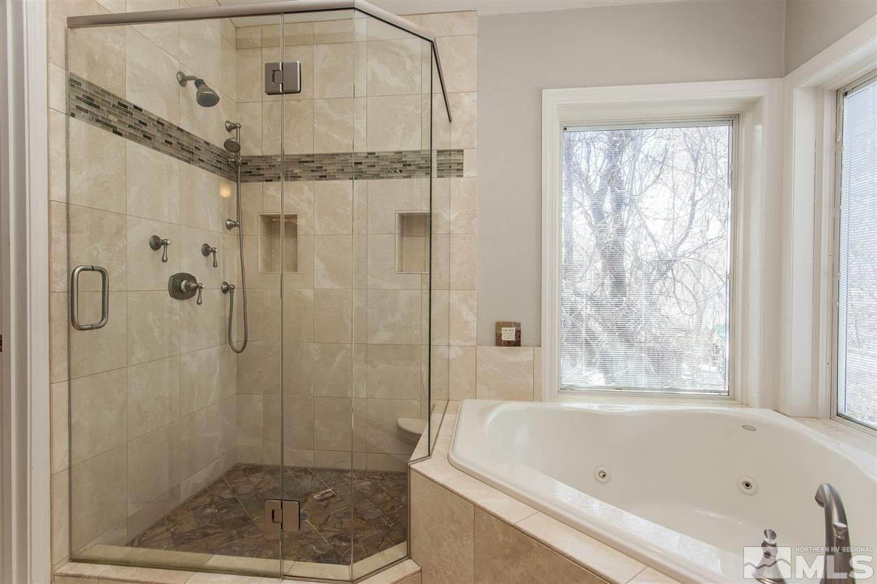 3985 Riverhaven Drive Reno, NV 89519 - Photo 14 of 25 a bathroom with a bath tub and shower