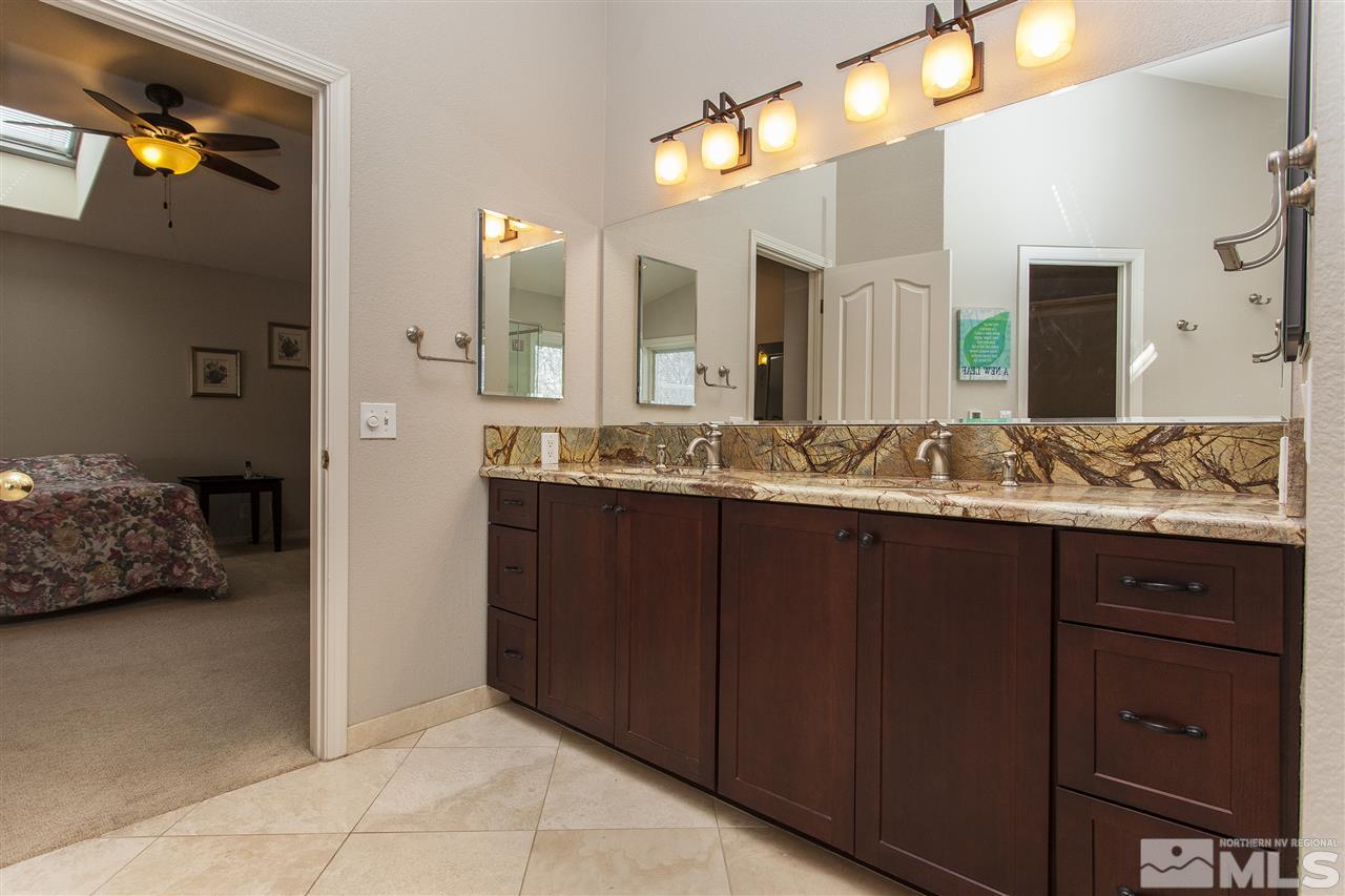 3985 Riverhaven Drive Reno, NV 89519 - Photo 15 of 25 a bathroom with a sink and a mirror