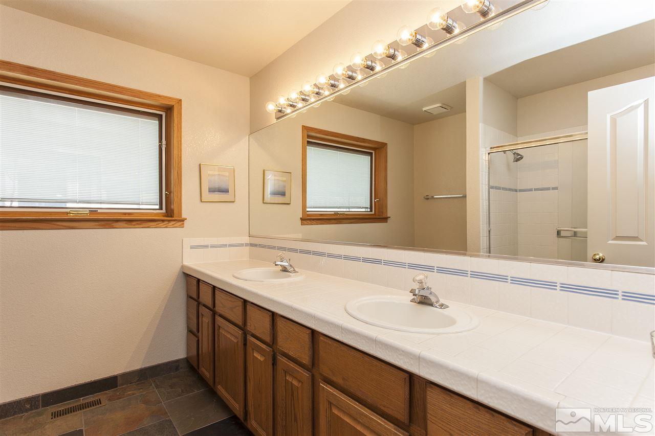 3985 Riverhaven Drive Reno, NV 89519 - Photo 19 of 25 a bathroom with a sink and a mirror