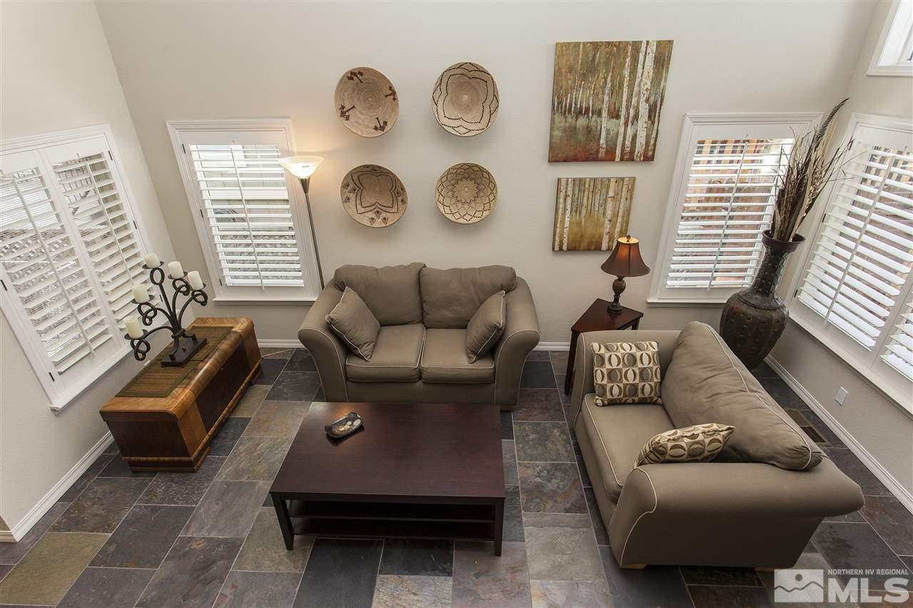 3985 Riverhaven Drive Reno, NV 89519 - Photo 3 of 25 a living room with furniture a clock and a window