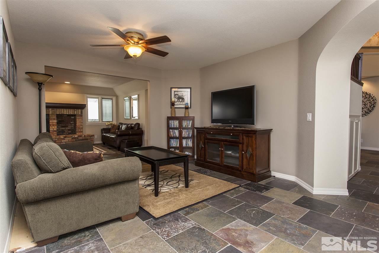 3985 Riverhaven Drive Reno, NV 89519 - Photo 4 of 25 a living room with furniture and a flat screen tv with kitchen view